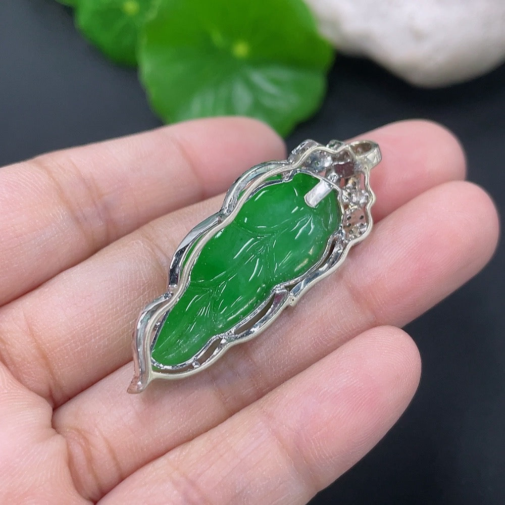 Jadeite leaf pendant necklace with mixed gold components, featuring a delicate natural design and non-diamond accents.