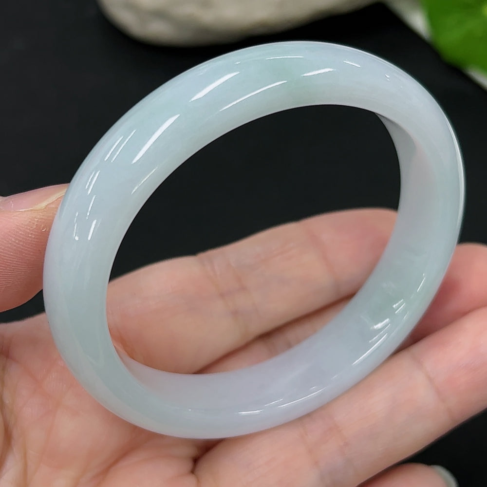 HKHQ Jadeite oval bangle bracelet, size 54.6, 44.9g, showcasing smooth, polished jadeite in an elegant oval shape.
