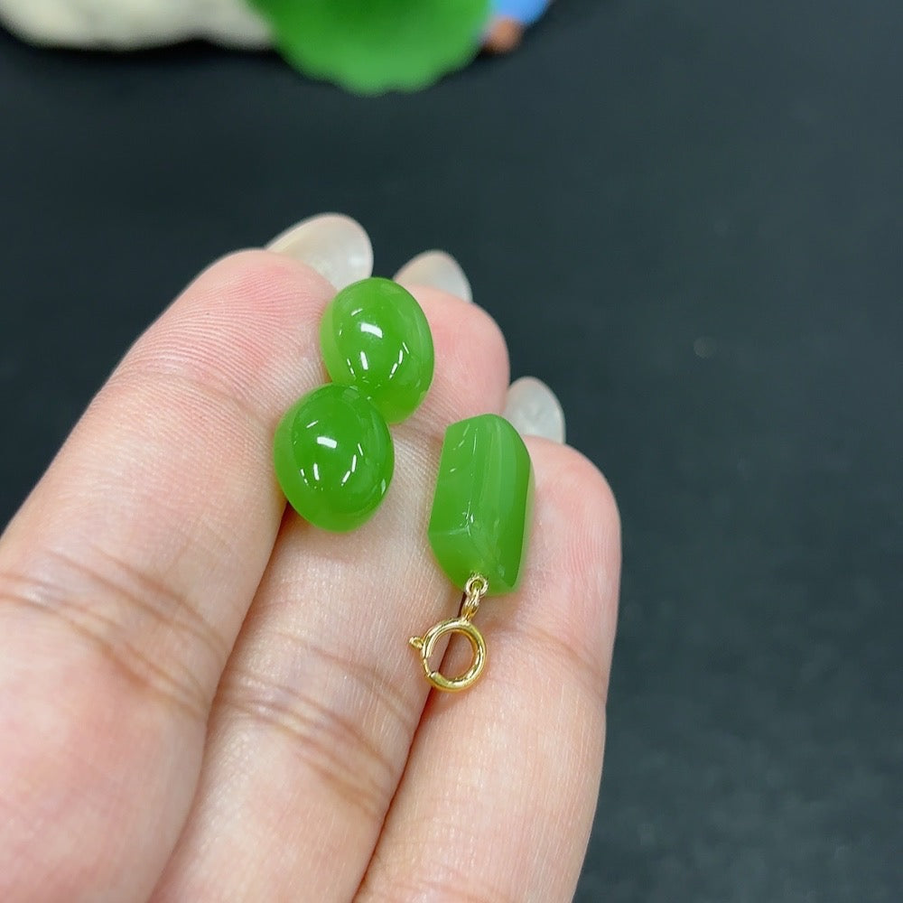 HKHQ Hetian Jade inlaid pendant and earrings set featuring polished 18K gold and intricate jade detailing.