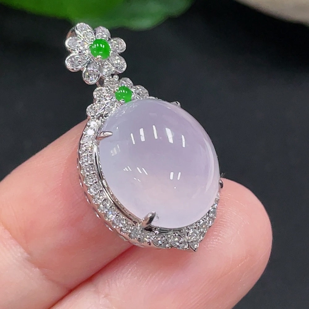 Jadeite pendant with 18K gold setting and diamond accents, featuring a smooth green jade stone on a delicate chain.