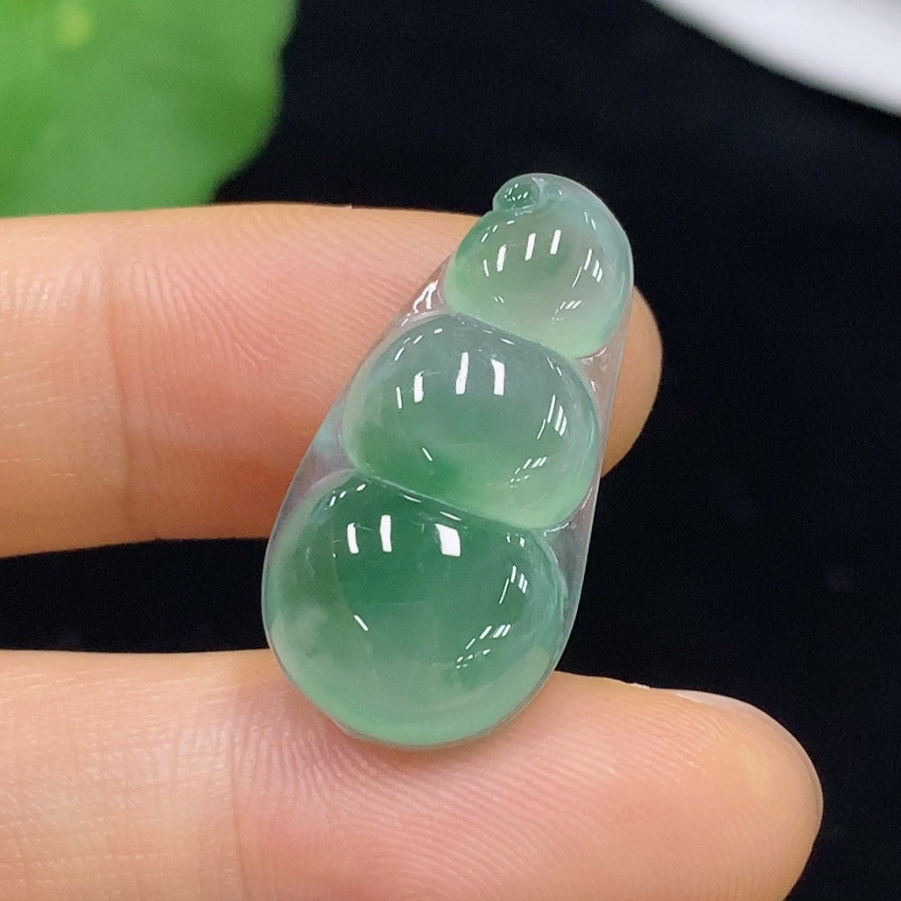 Close-up of Jadeite auspicious bean inlay piece by HUILIU HQ, showcasing smooth jade surface and intricate design, weighs 3.13g.