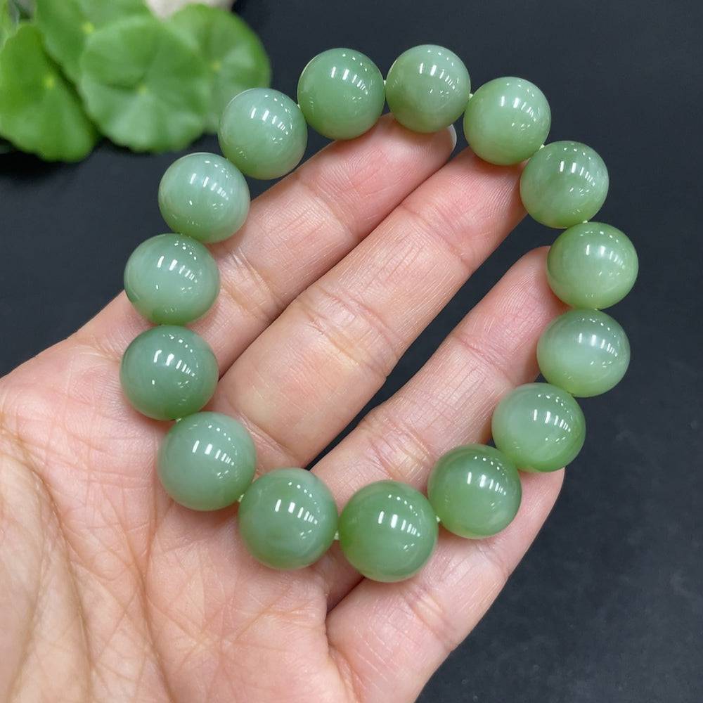 Huiliu Hetian Jade Jasper bracelet with 11.8mm beads, natural jade jewelry, certified Huiliu jade bracelet on a neutral background