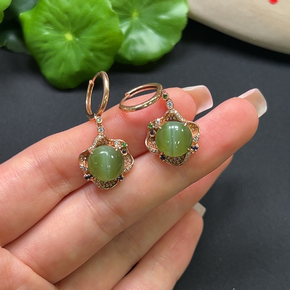 Hetian jade earrings with 18K gold and diamond accents, featuring intricate design and a total weight of approximately 7.2 grams.