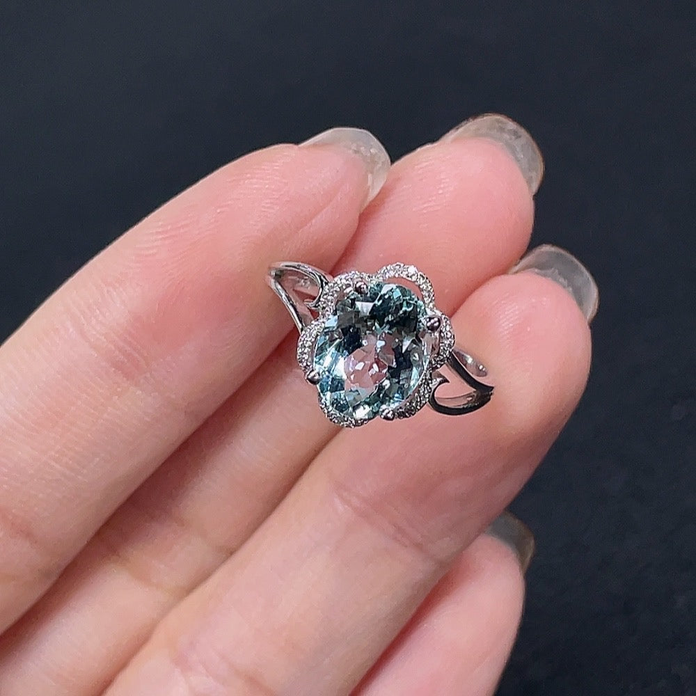 Aquamarine gemstone ring by HKHQ featuring diamond accents, 18K gold band, size 14, with a total weight of 3.02g.