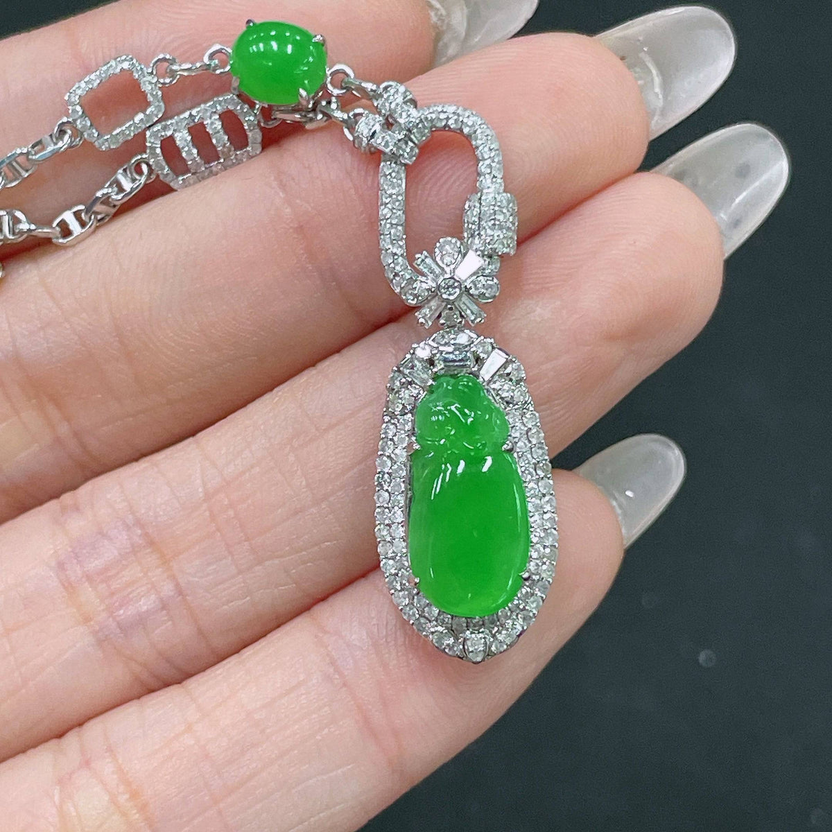 Jadeite necklace with 18k gold chain and diamond accents, crafted by HUILIU HQ, weighing approximately 10.4 grams.