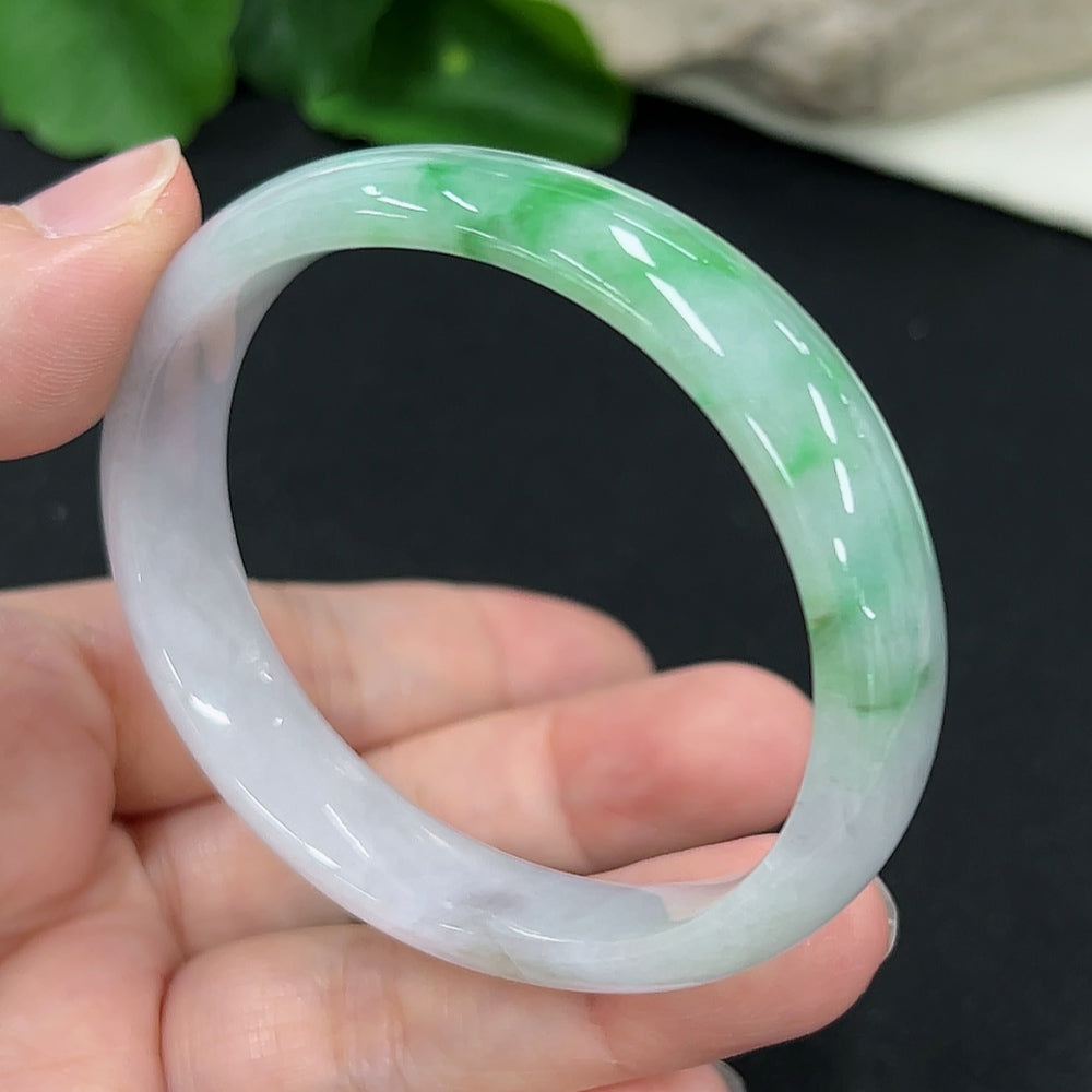 Jadeite concubine bracelet by HKHQ featuring smooth green jade beads, size 56.9/48.5, total weight approx. 33.8g.