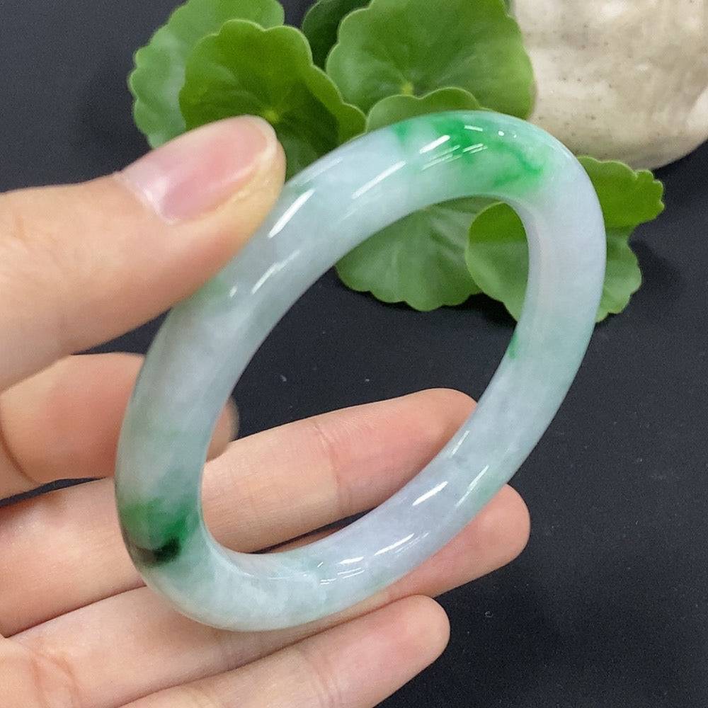 HUILIU HQ jadeite round bangle size 53.1 with mineral components, weighing approximately 46.2 grams, showcasing smooth, polished jade surface.