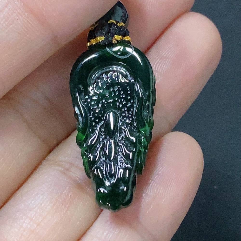 Huiliu Jadeite pendant featuring a carved dragon plaque with rope attachment, crafted from green jade for jewelry or display.