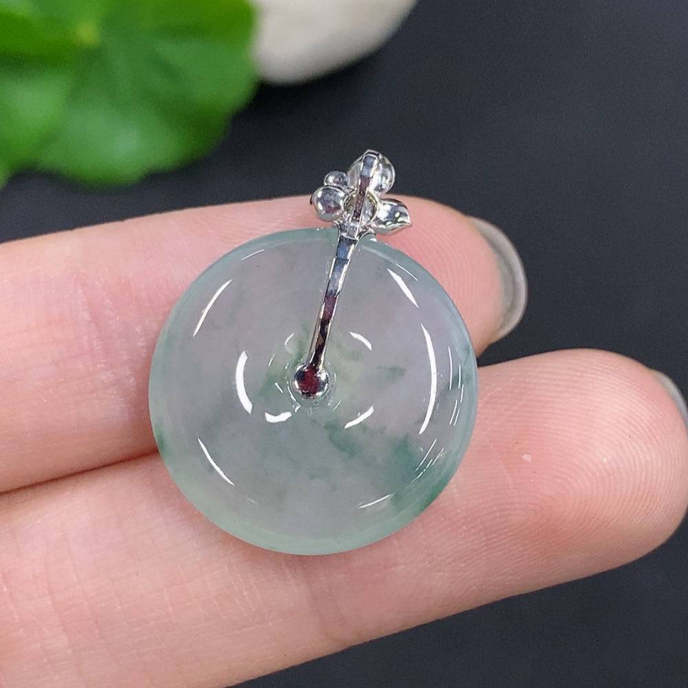 Jadeite peace knot pendant with 18K gold clasp, crafted from smooth green jade, weighing approximately 4 grams.