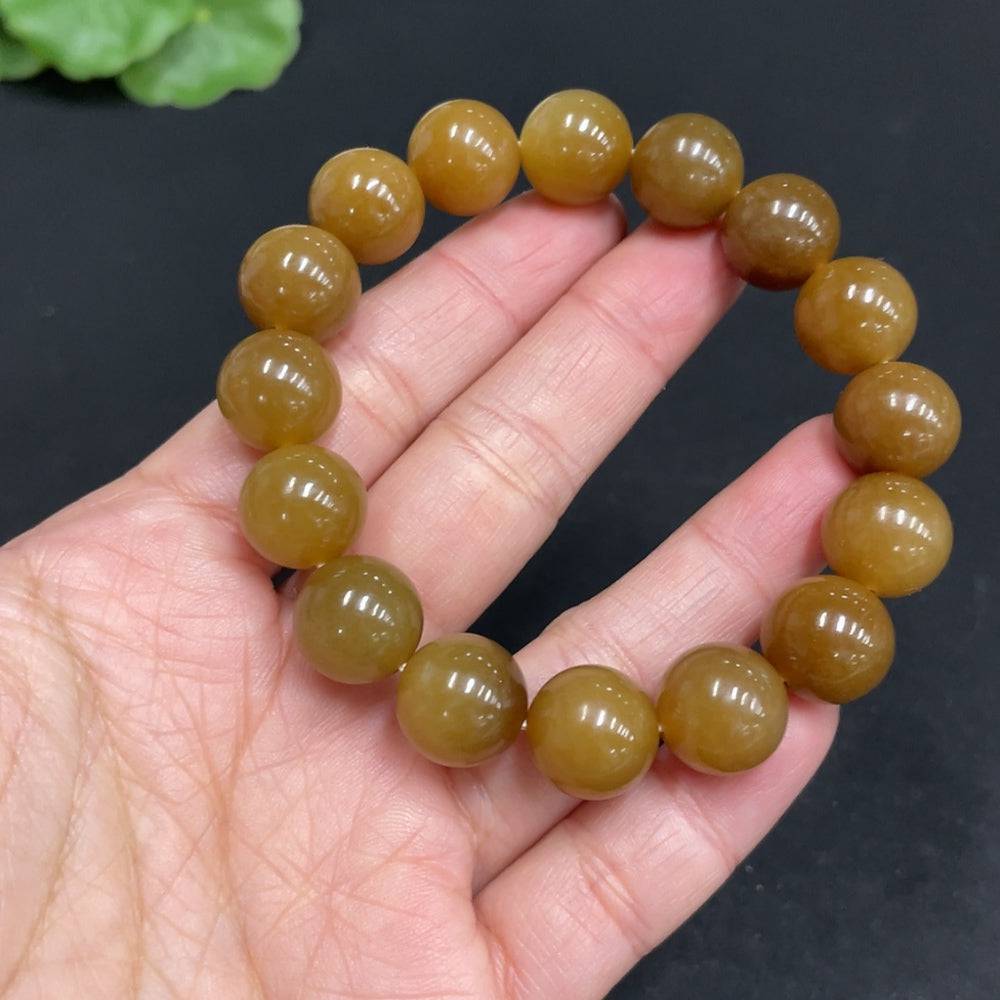 Hetian Jade bracelet with 11.6mm beads and 42g weight, crafted by HUILIU HQ, featuring smooth, polished jade stones.
