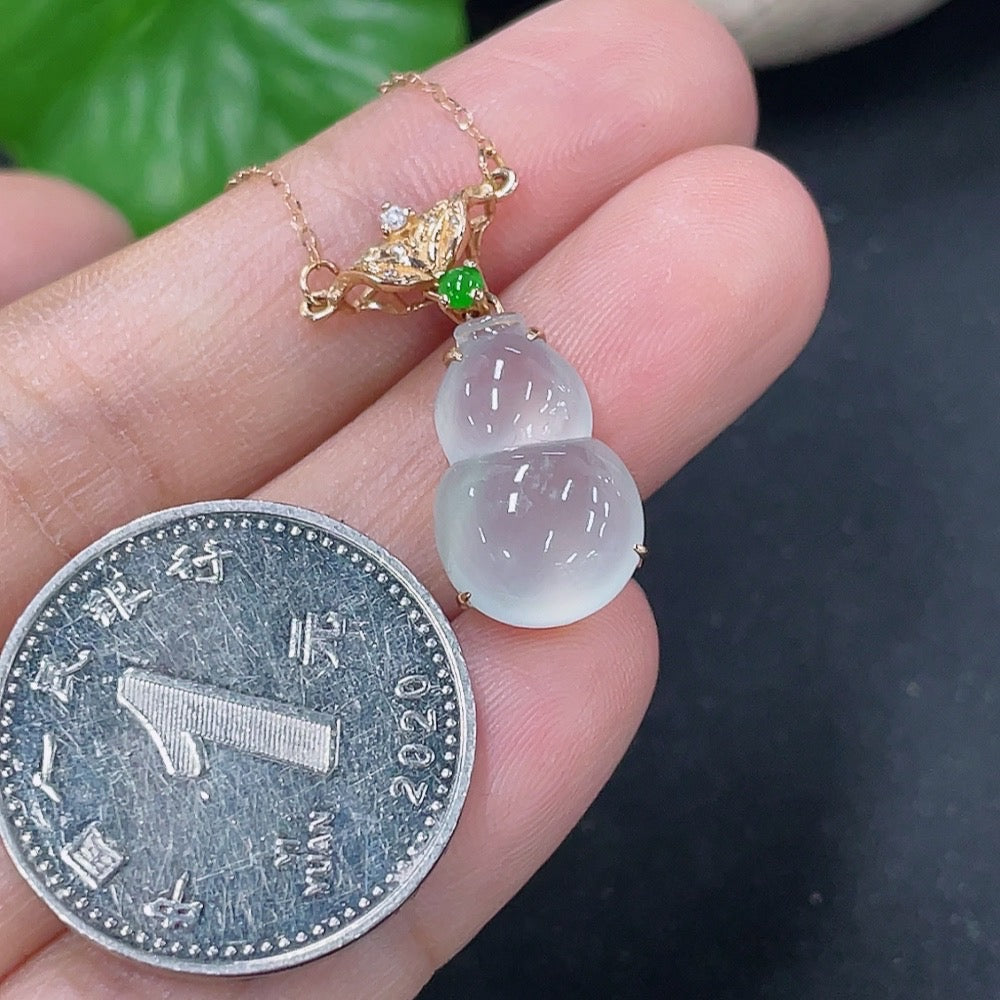 Jadeite inlaid gourd pendant with 18K gold and diamond accents, elegant necklace featuring detailed craftsmanship.
