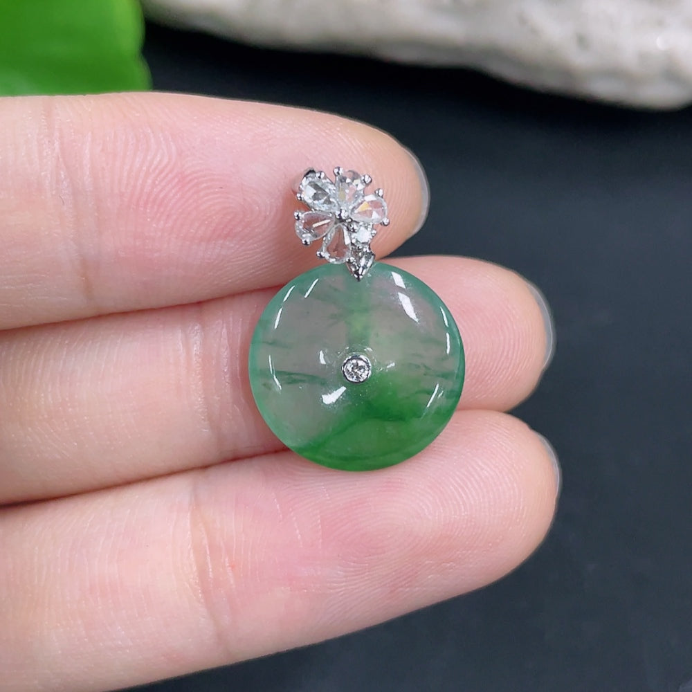 Jadeite pendant with 18K gold and diamond accents, showcasing a polished green jade stone on a delicate gold chain.