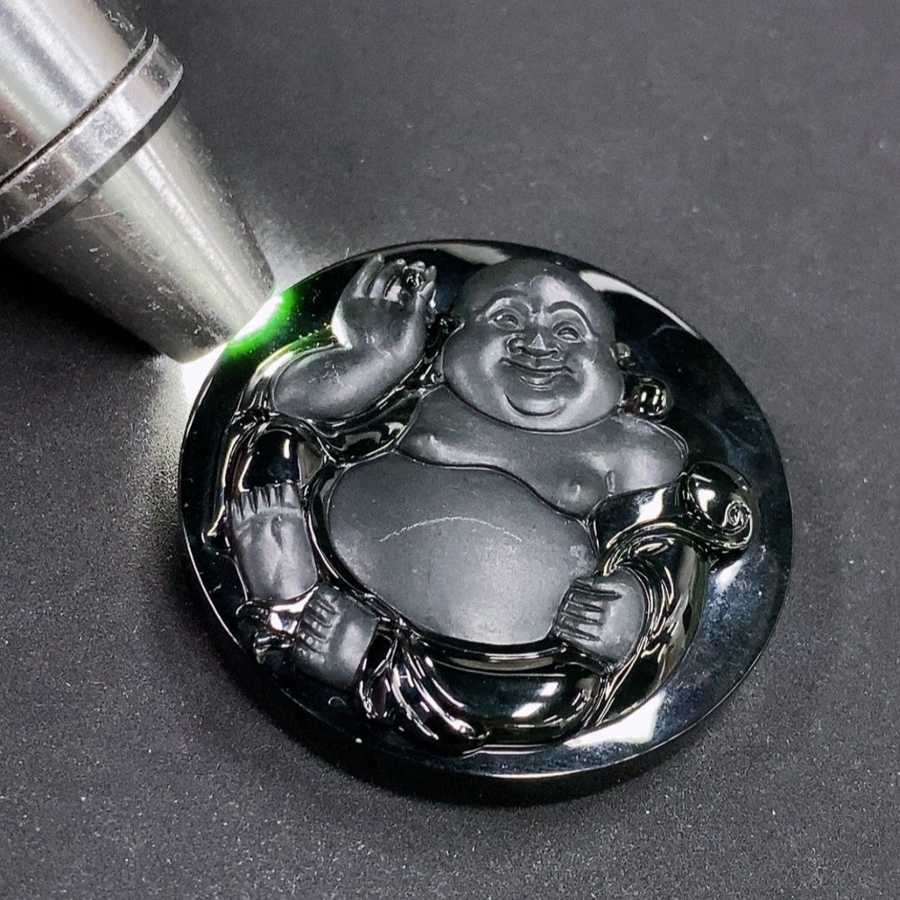 Jadeite Buddha pendant from HKHQ, weighing approximately 44.6g, featuring a detailed carved Buddha figure on smooth jade stone.