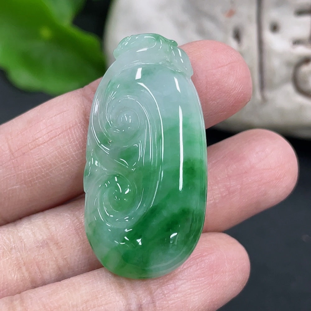 Jadeite Ruyi pendant necklace from HKHQ featuring a polished green jadeite design, displayed on a neutral background.