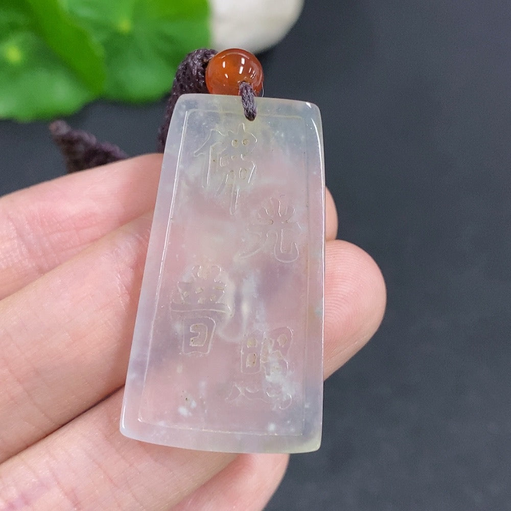 Jadeite Buddha pendant with carved figure, approximately 9.3g, featuring a jade pendant from HKHQ on a rope.