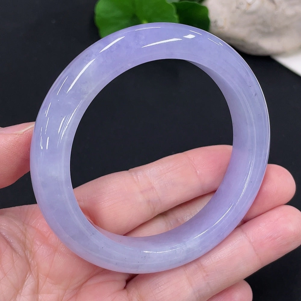 Jadeite round bangle in size 55.8 with approximately 63g weight, crafted by HUILIU HQ, showcasing smooth, polished jade surface.