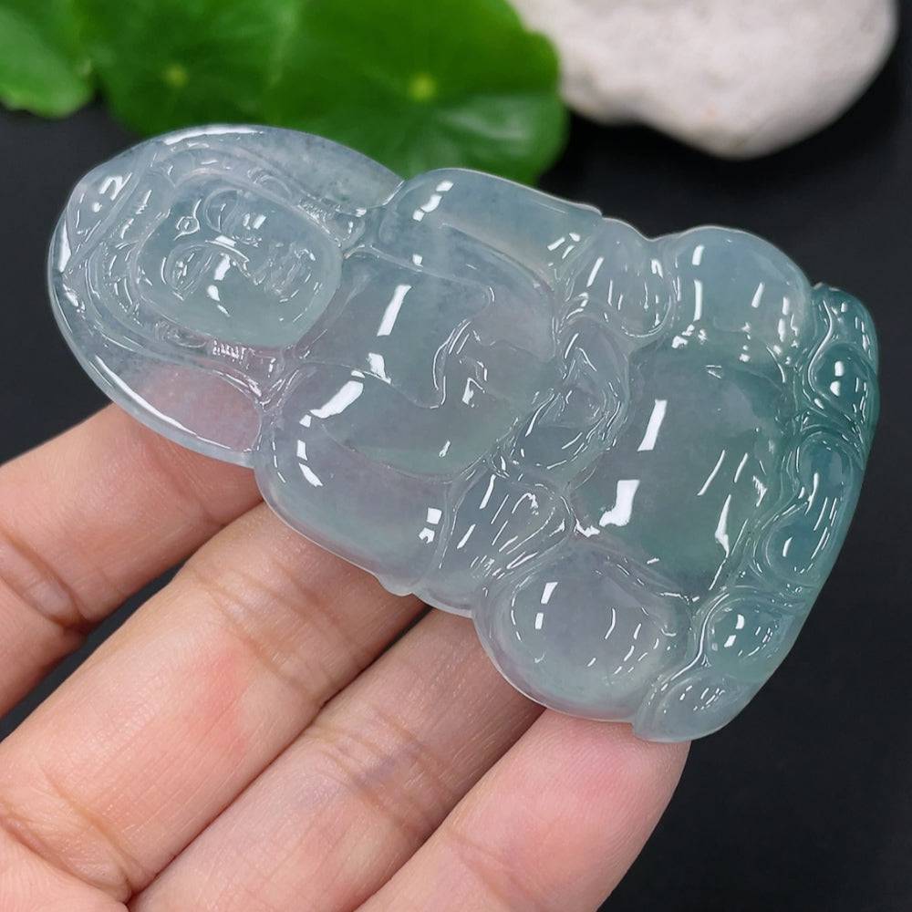 Jadeite Guanyin pendant from HUILIU HQ, carved jade figure weighing approximately 27.26g, detailed and polished for display.