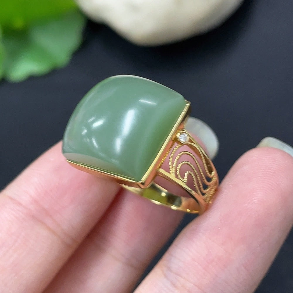 Hetian Jade inlaid ring with diamond accents in 18K gold, showcasing intricate craftsmanship and elegant jewelry design