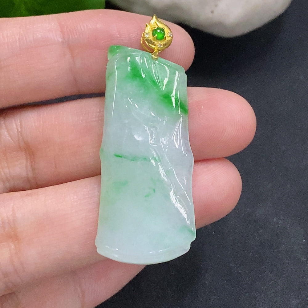 Jadeite bamboo pendant with 18K gold clasp, showcasing smooth green jade and a secure gold closure, weighs approximately 7.1g.