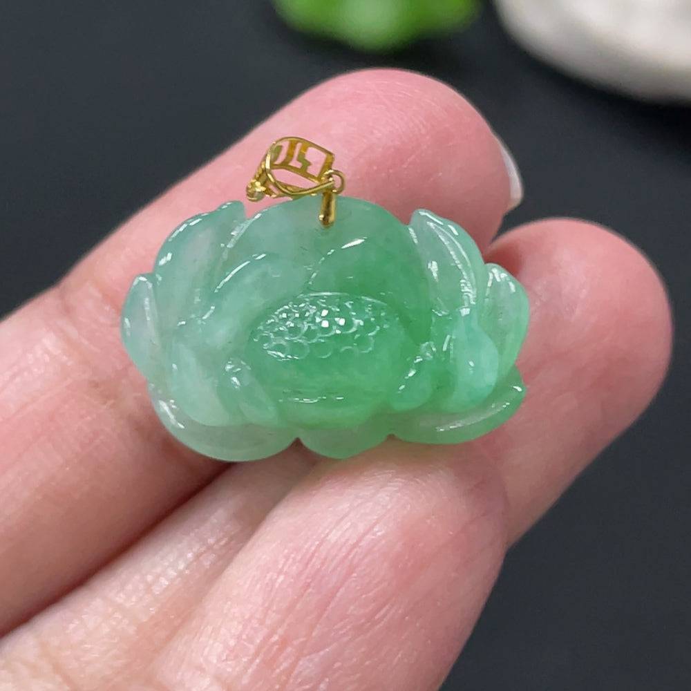 Jadeite lotus pendant with 18k gold clasp, crafted from green jade, weighs approximately 3.38g, elegant jewelry piece.