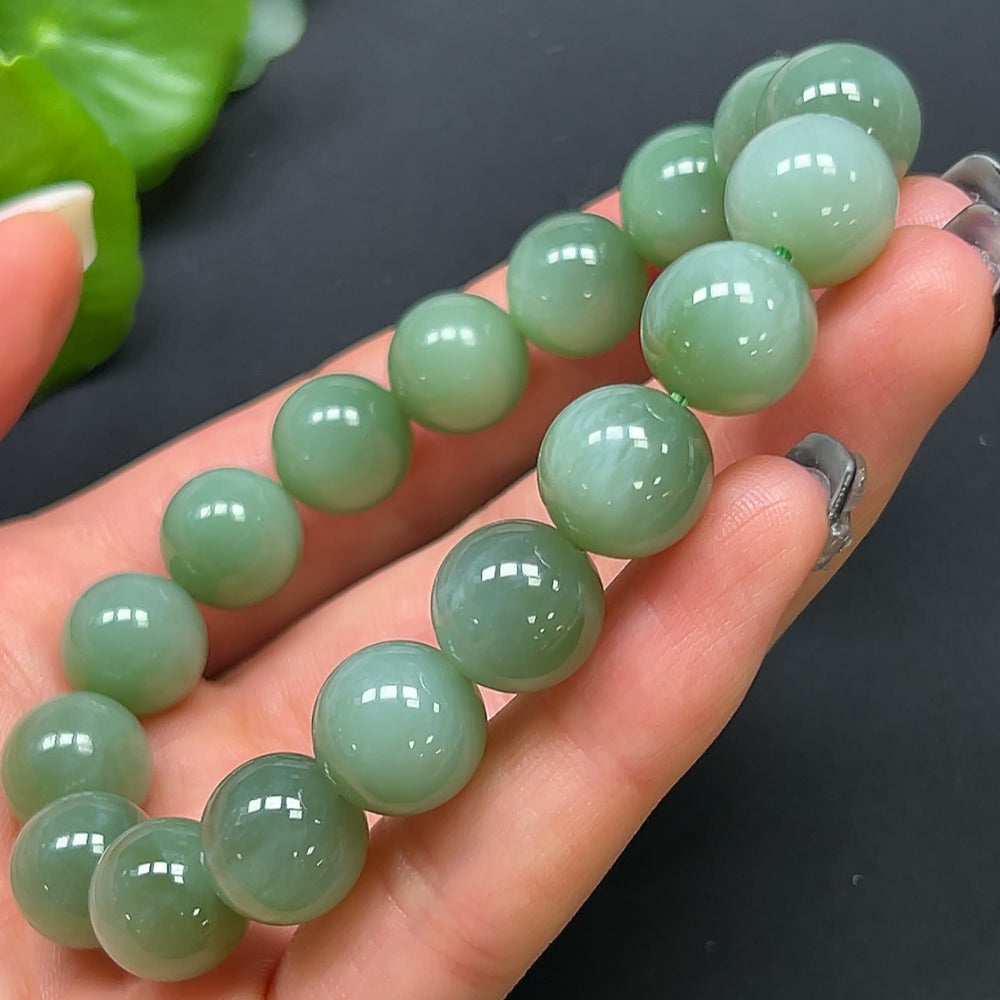 Hetian jade bracelet with 11.8mm beads, weighing approximately 44.38g, featuring smooth, polished green jade stones.