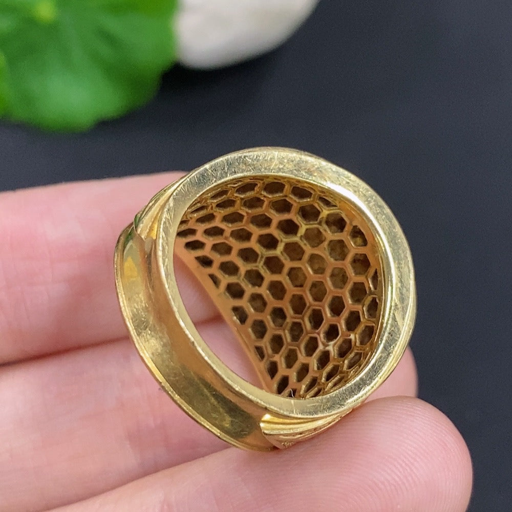 Elegant jadeite cabochon ring with 18K gold band by HKHQ, featuring a smooth, polished green jade stone on a sleek gold setting.