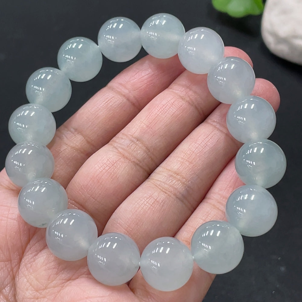 Huiliu certified Jadeite bracelet with 13mm smooth green jade beads, elegant jewelry accessory showing the bracelet on a white background.