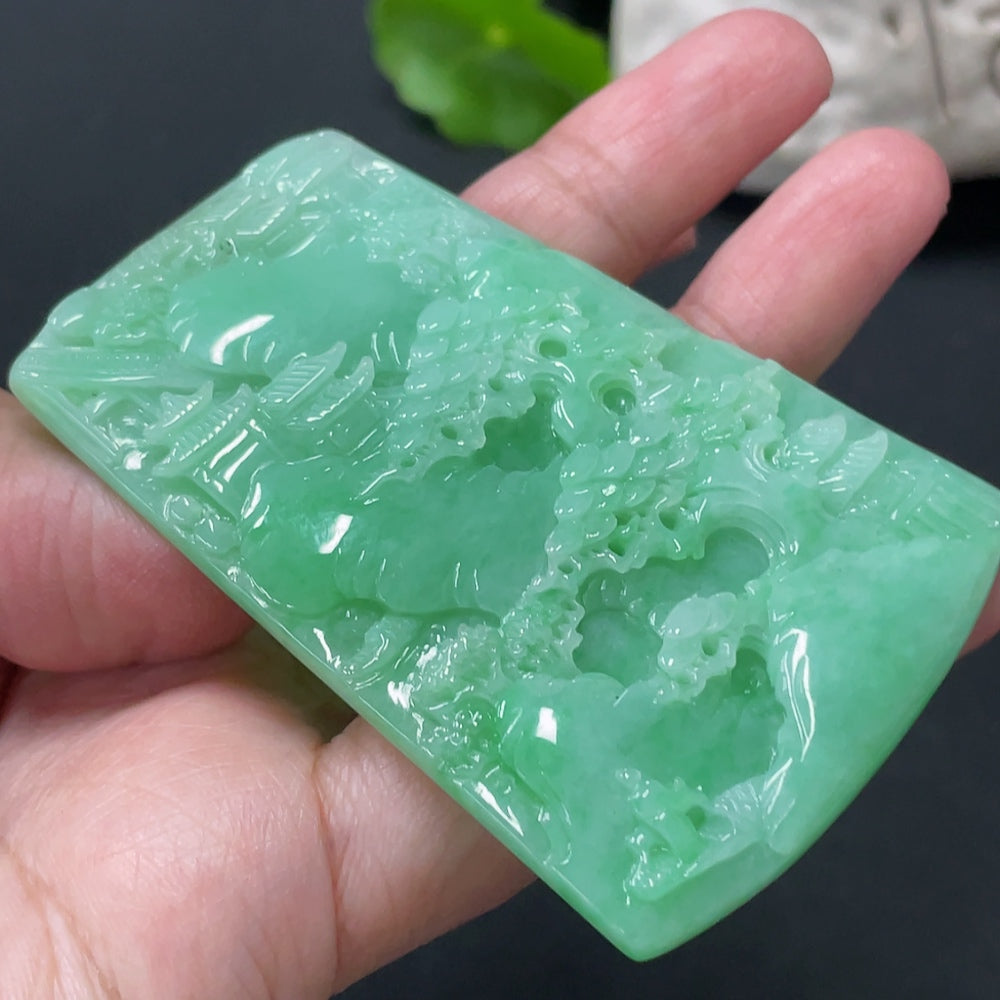 Huiliu Jadeite landscape pendant featuring intricate carvings and natural green jade, approximately 1 inch tall.
