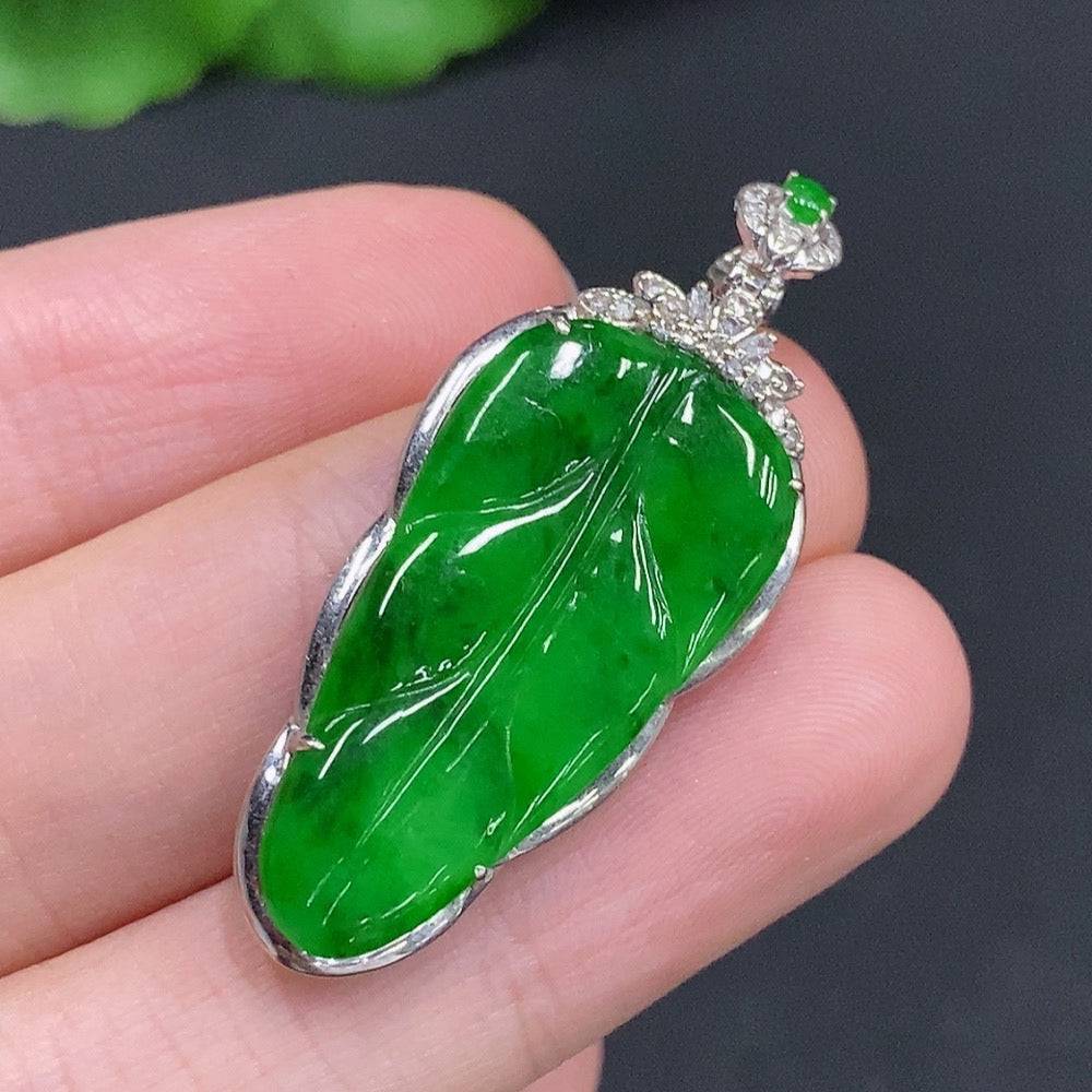 Jadeite leaf pendant with 18k gold and diamond accents, featuring a delicate green jade leaf design with sparkling details.