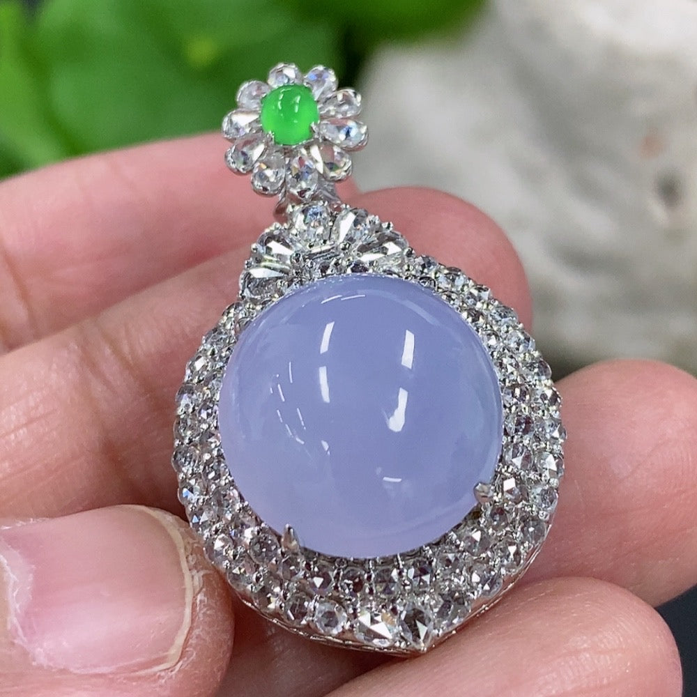 Jadeite cabochon pendant with 18K gold setting and diamond accents, elegant necklace featuring polished gemstone and fine craftsmanship.