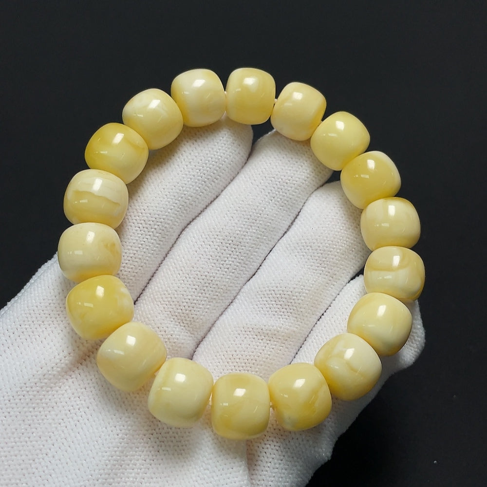 Amber beeswax bracelet by HKHQ featuring natural amber beads and a bracelet design, weighing 19.71 grams.