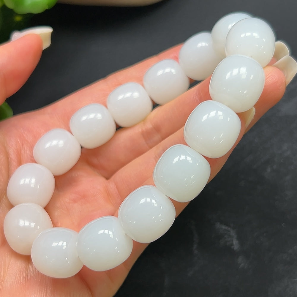 HKHQ Hetian Jade bracelet weighing 87.51g, showcasing smooth, polished green jade beads linked in a stylish bracelet.
