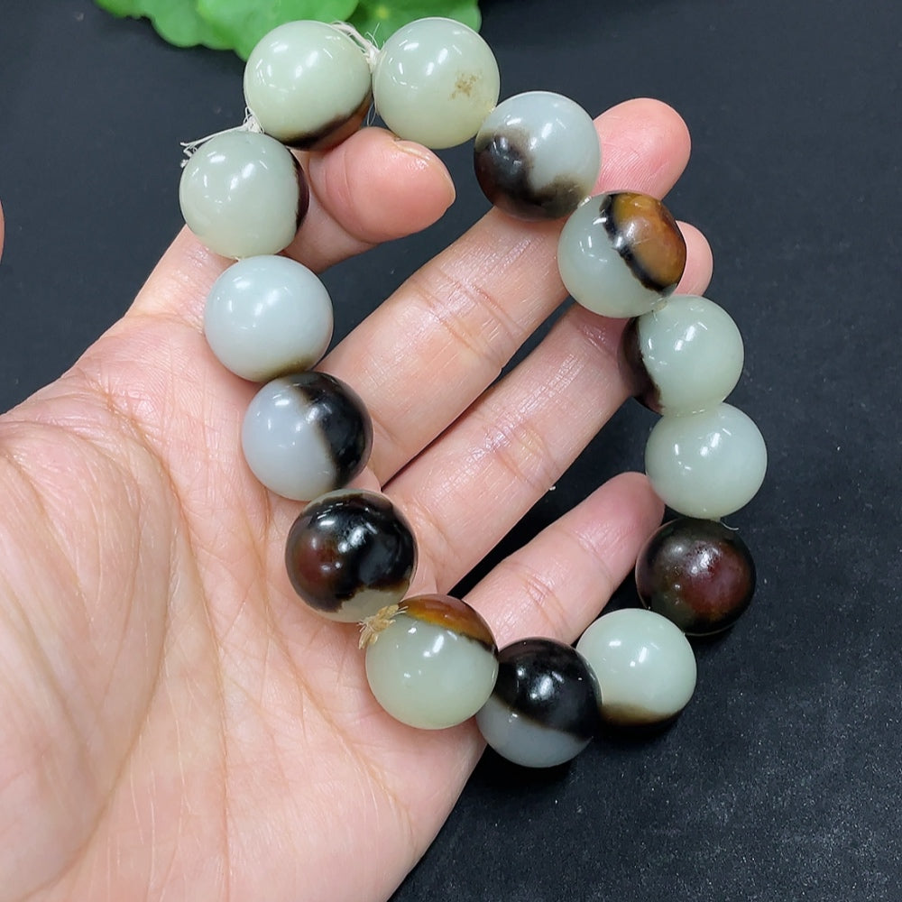 Hetian Jade bracelet with 15.5mm beads, weighing 83g, featuring natural jade stones and undetermined skin tone, by HKHQ.