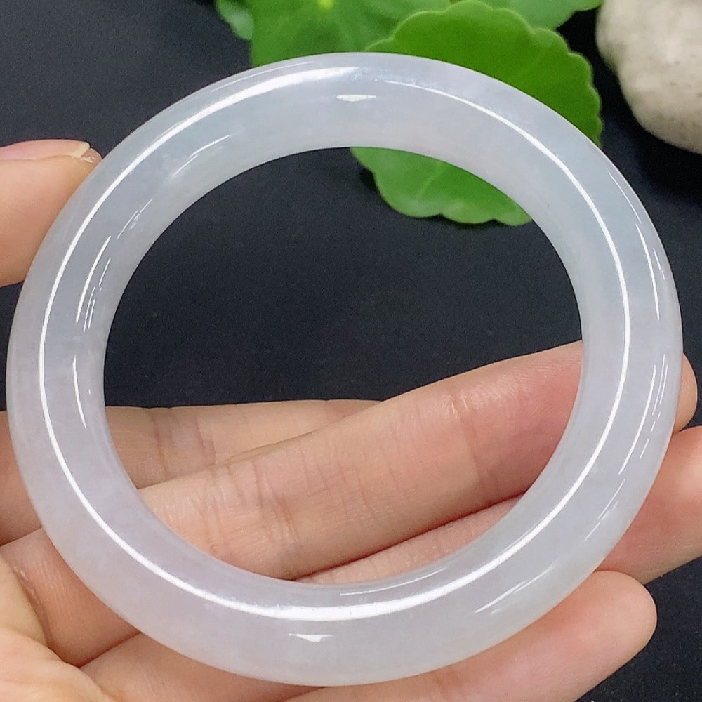 Jadeite round bangle in size 50.2 with a weight of 50.18g, featuring smooth, polished jade craftsmanship by HKHQ.