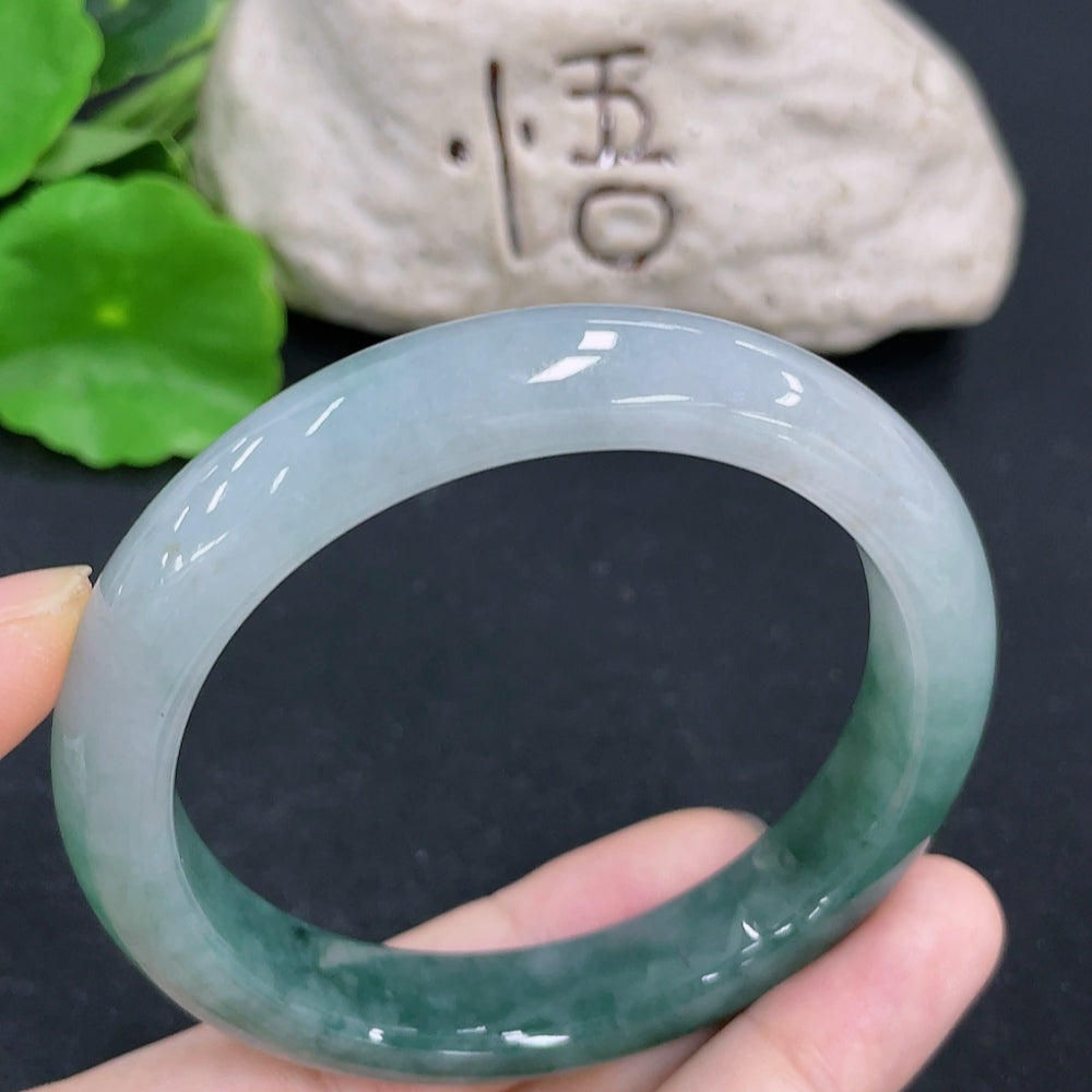 HKHQ jadeite round bangle with a 58.8mm size and 58.9g weight, showcasing smooth, polished jadeite surface.