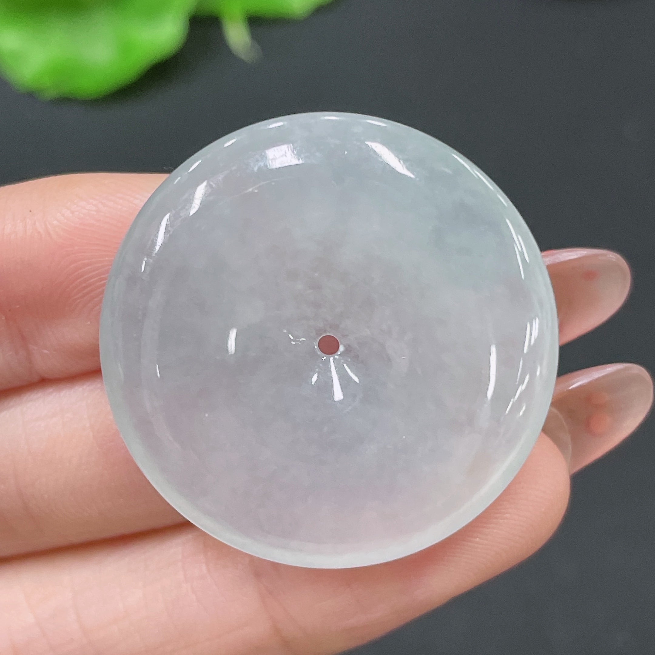 Jadeite pendant featuring a peace knot design, weighing about 11.4g, crafted by HUILIU HQ with smooth, polished green jade.