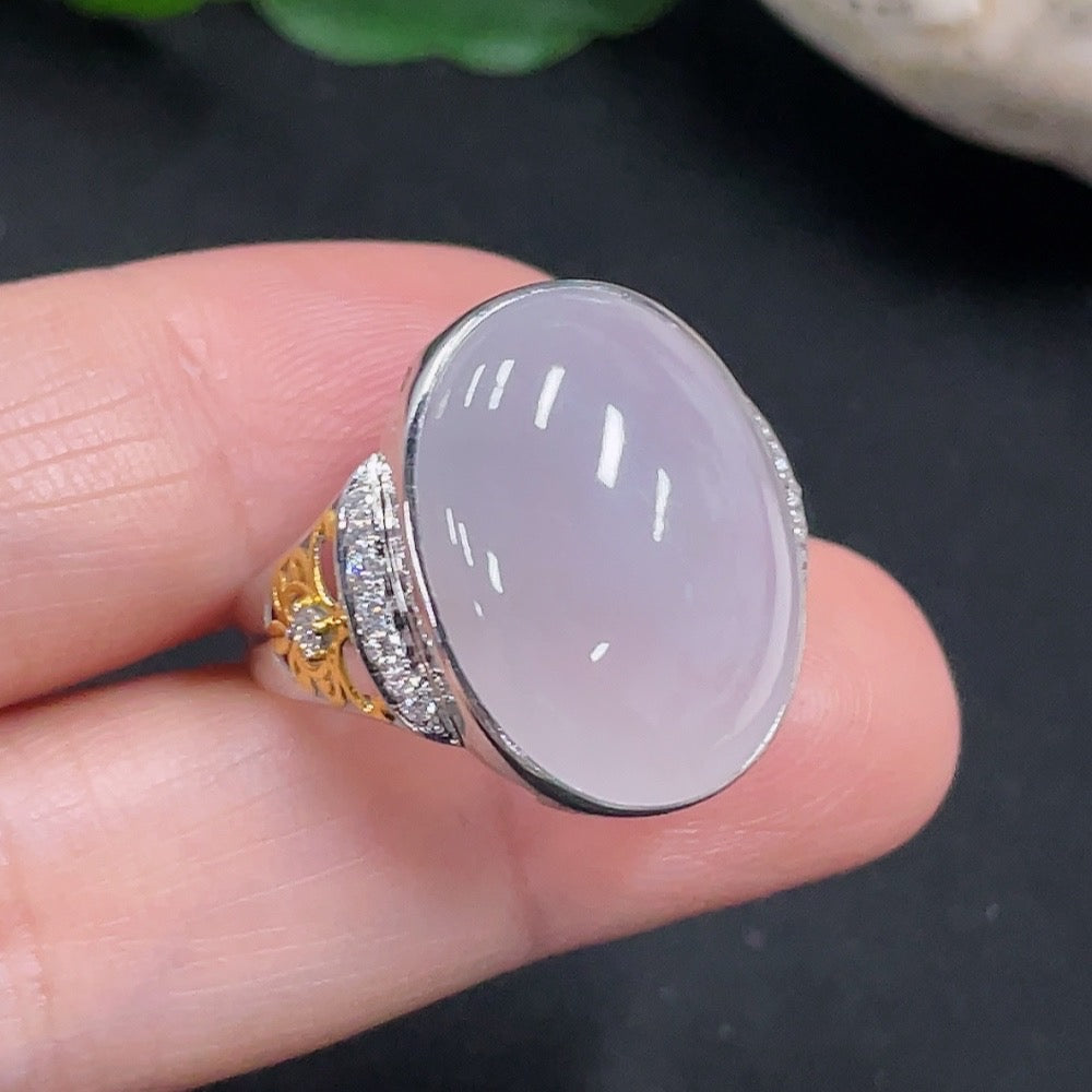 Huiliu Jadeite ring with diamond accents, featuring a polished jade stone and sparkling diamond details on a silver band.