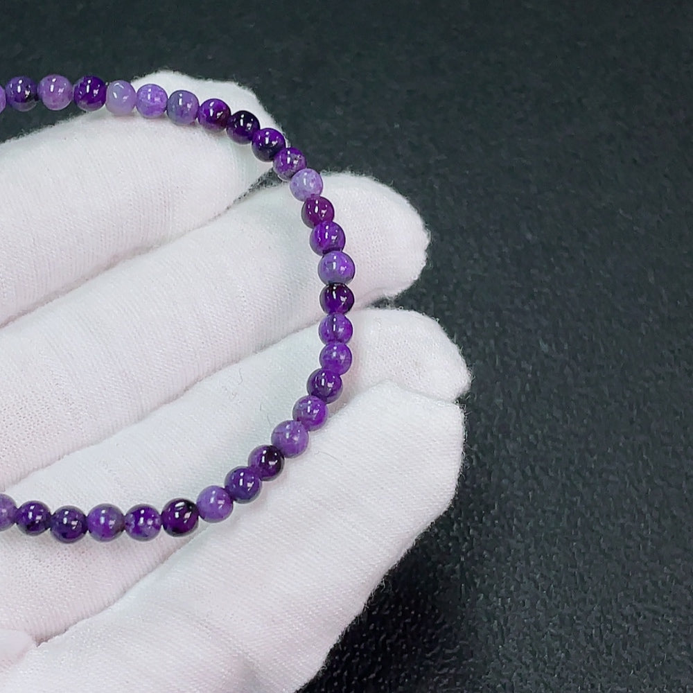 Purple Sugilite gemstone bracelet with 4mm beads, featuring organic mineral inclusions, total weight 4.32g, from HKHQ.