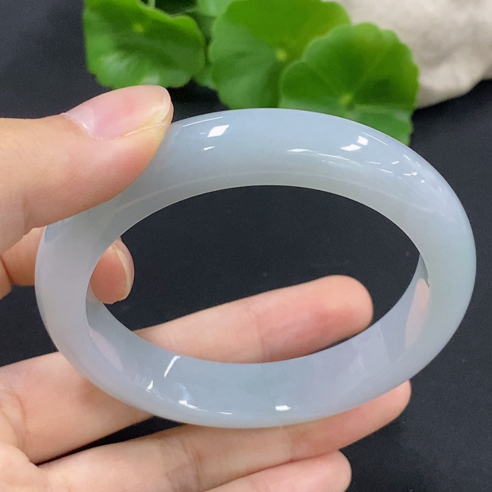 HKHQ jadeite round bangle in size 56.1, showcasing smooth green jadeite with a polished finish and elegant circular design.
