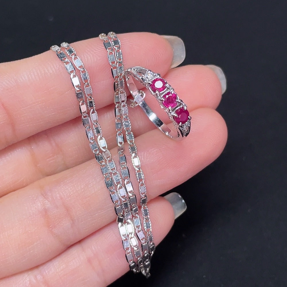 18k gold Ruby inlaid ring with diamond accents, size 13, weighing approximately 4.69g, featuring intricate band details.