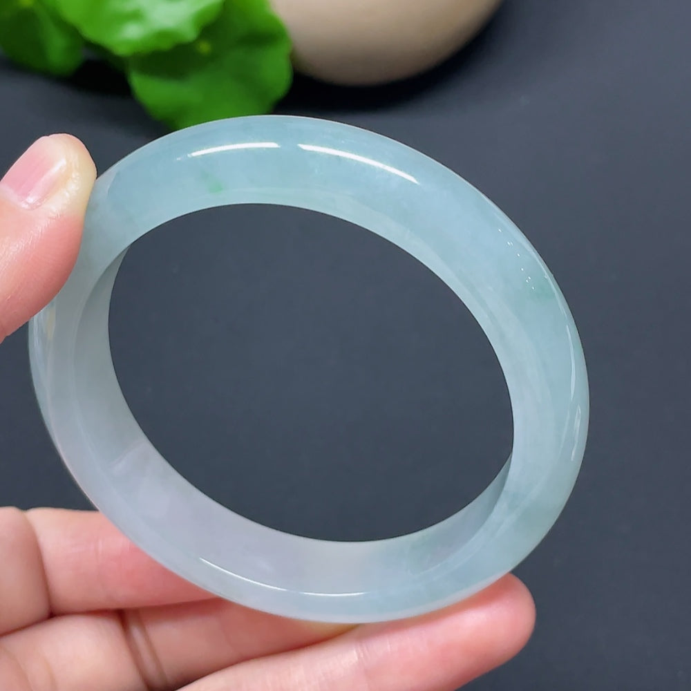 HKHQ jadeite round bangle, size 57.2, weighs 56.76g, showcasing smooth, polished green jadeite bracelet with intricate details.