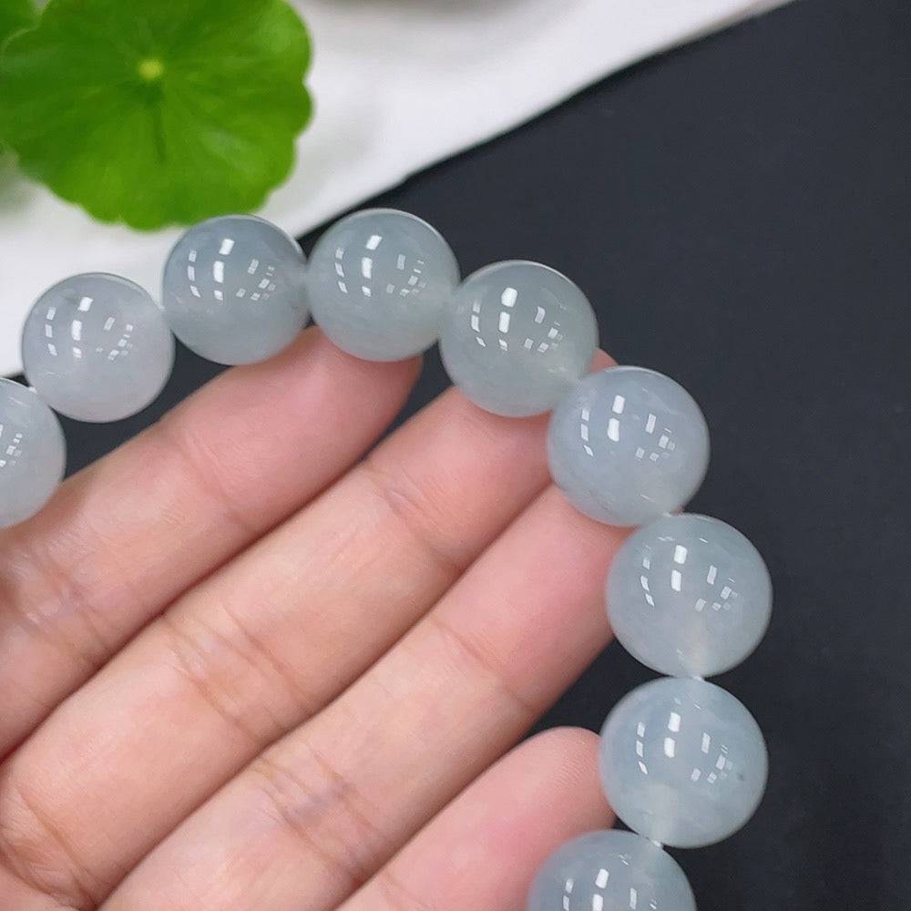Huiliu Jadeite bracelet with 12.8mm beads, certified jade jewelry featuring smooth, polished green jade stones.