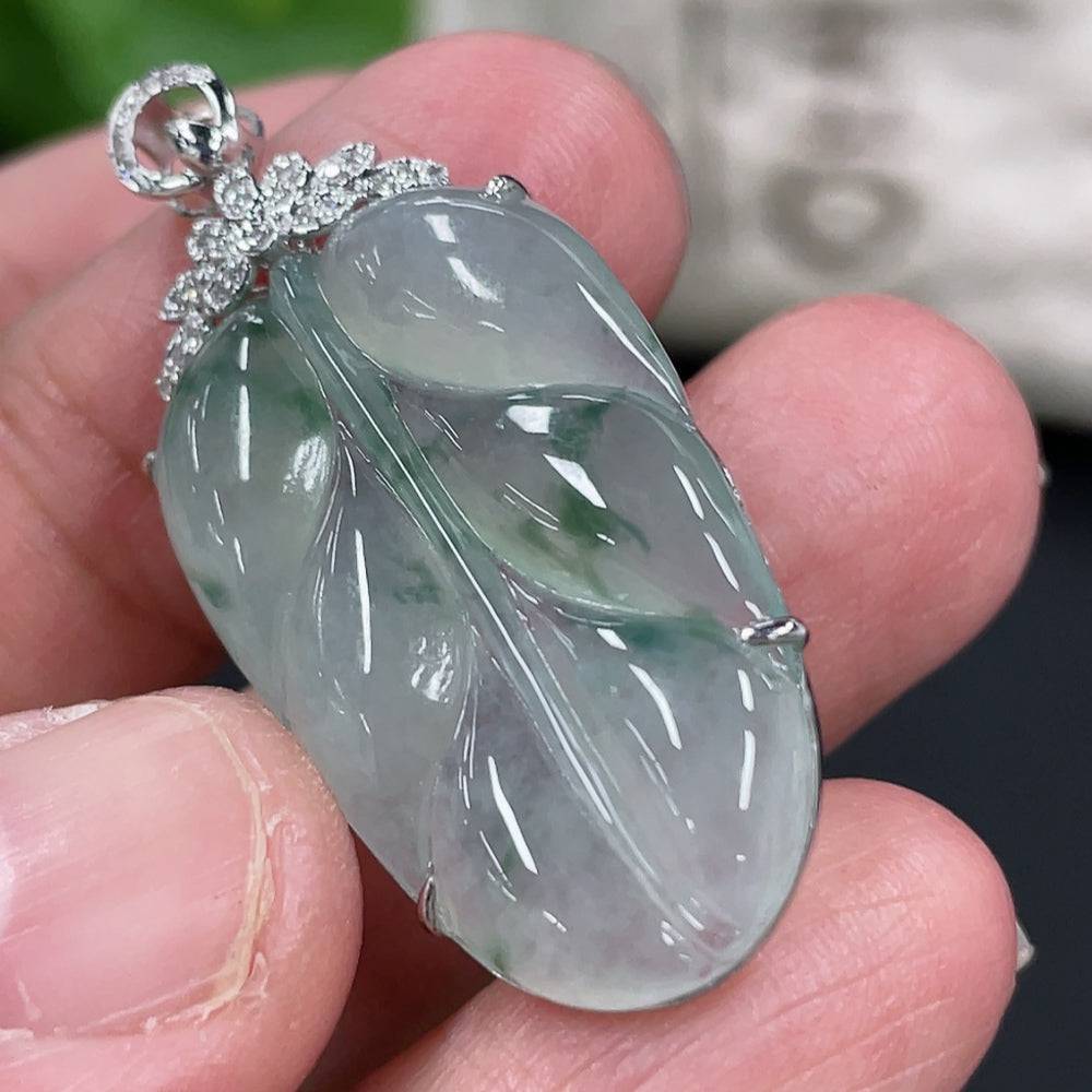 Jadeite leaf pendant with 18K gold setting and diamond accents, crafted by HUILIU HQ, showcasing intricate leaf design and gemstones.
