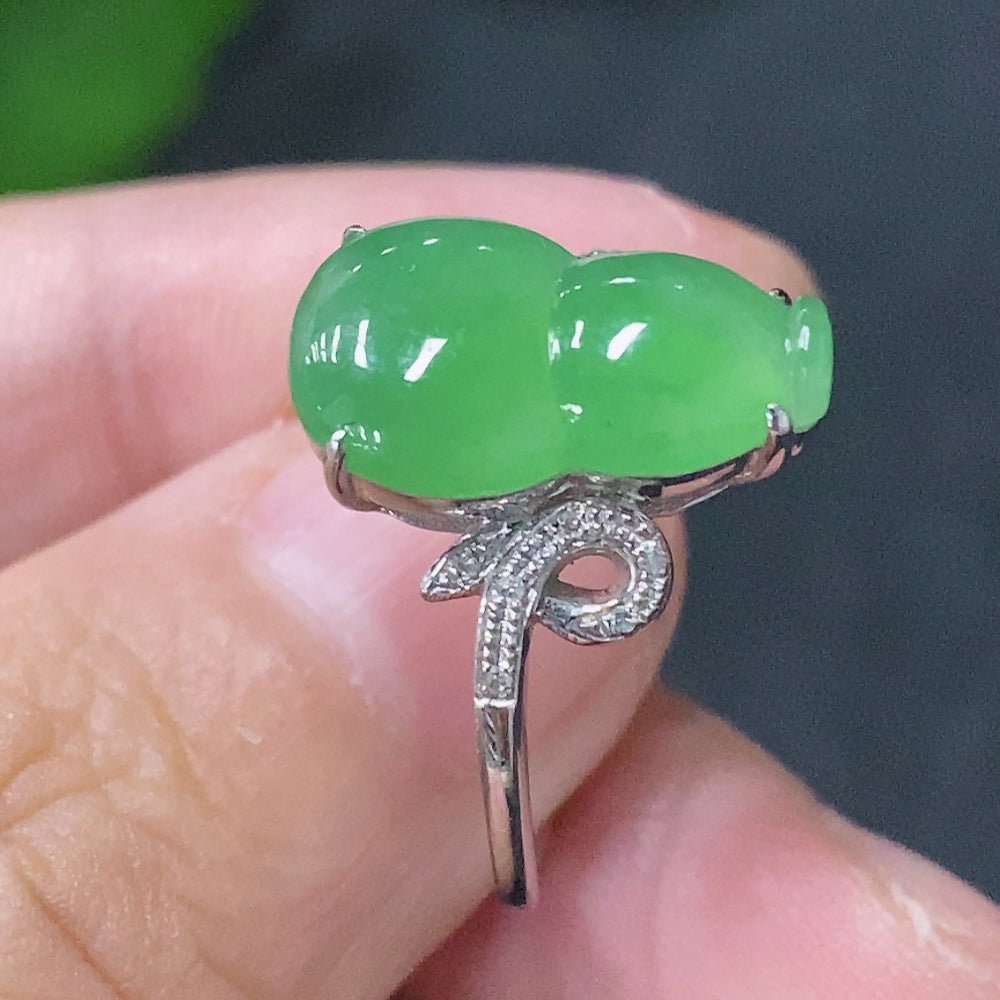 Huiliu Jadeite inlaid ring with diamond accents, featuring a polished jadeite gemstone set in a silver band.