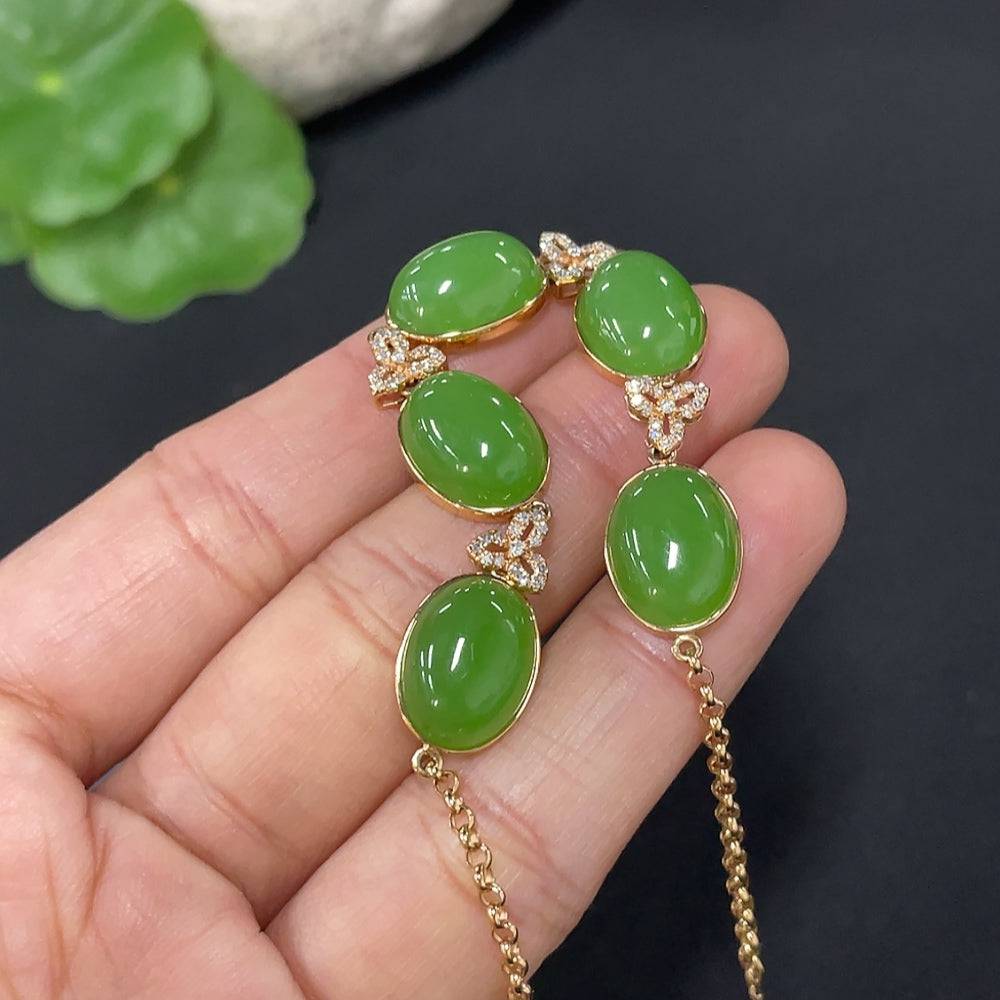 Huiliu Jade cabochon inlay bracelet with diamond accents and suspected plated parts, showcasing elegant design and craftsmanship.