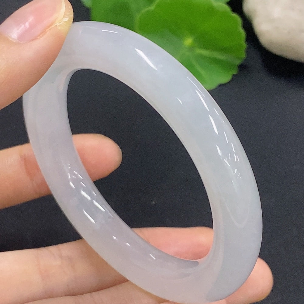 Jadeite round bangle in size 50.2 with approximately 50.18g weight, showcasing smooth, polished green jade from HKHQ.