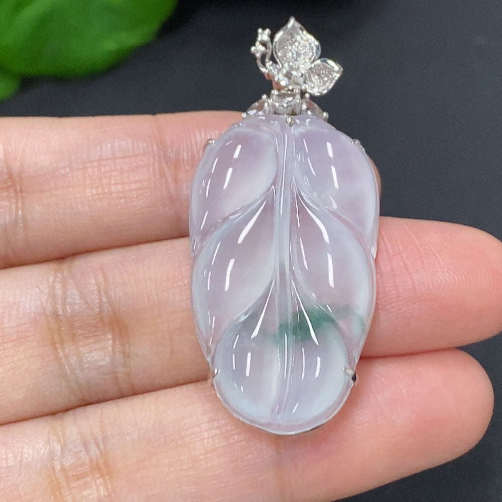 Jadeite leaf pendant necklace with 18K gold and diamond accents, featuring detailed leaf design and elegant craftsmanship.