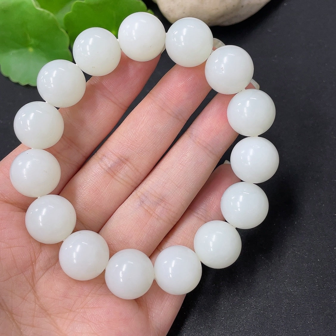 Hetian jade bracelet by HKHQ with 13.6mm beads and 62g weight, featuring smooth, polished jade stones on a delicate bracelet.