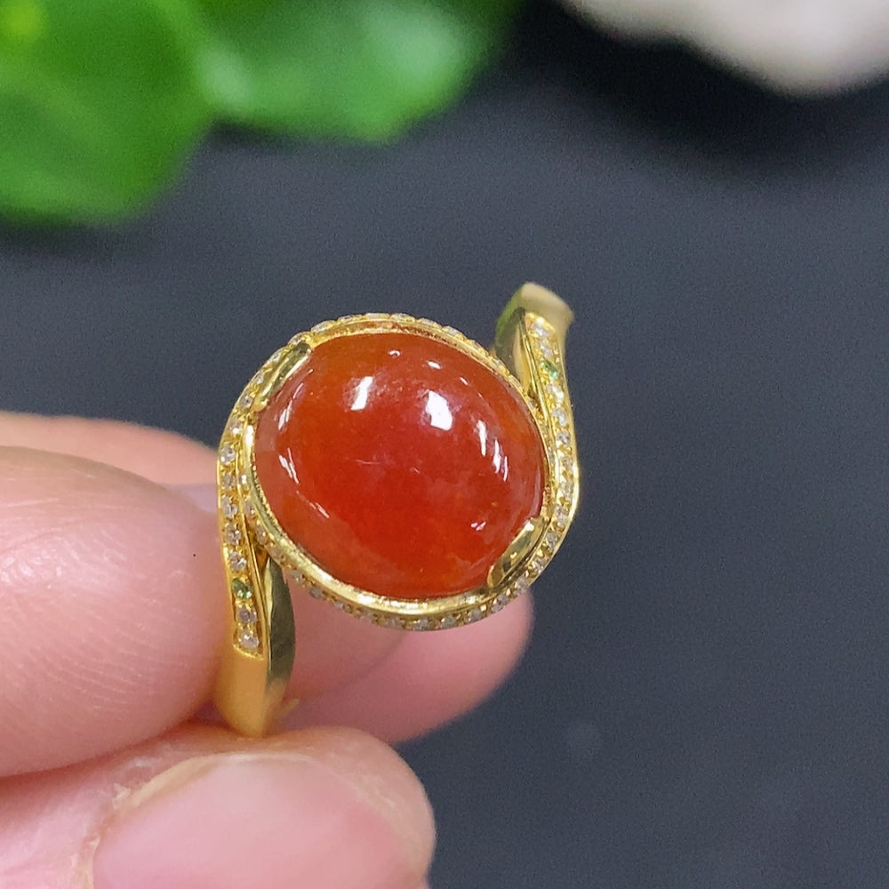 Huiliu Jadeite cabochon ring featuring colorless diamond accents, set in a silver band with intricate detailing.
