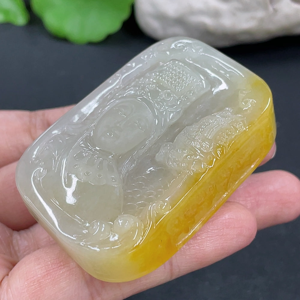 Jadeite Guanyin pendant from HKHQ featuring intricate carving, weighs approximately 64.7 grams, made of smooth, polished jade.